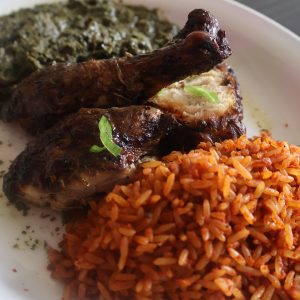 Jollof Chicken Pondu | Authentic tomato rice with charcoal-grilled chicken and cassava leaves at Ma Yve Grill